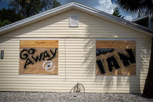 A house that tells "Go away Ian"  Just before Hurricane Ian made landfall on Indian Beach, 25 miles west of Tampa, Florida.  (Ricardo Arduengo/AFP).