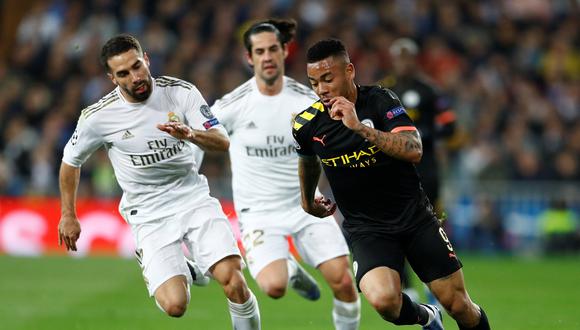 Soccer Football - Champions League - Round of 16 First Leg - Real Madrid v Manchester City - Santiago Bernabeu, Madrid, Spain - February 26, 2020  Real Madrid's Dani Carvajal in action with Manchester City's Gabriel Jesus  REUTERS/Juan Medina