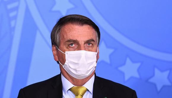 El presidente de Brasil, Jair Bolsonaro, asiste a la ceremonia de inauguración de un nuevo registro de pescadores profesionales, en el Palacio Planalto en Brasilia el 29 de junio de 2021. (Foto de EVARISTO SA / AFP).