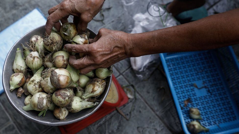 A pot full of onions in a market.  (ROLEX DELA PENA/EPA-EFE/REX/SHUTTERSTOCK).