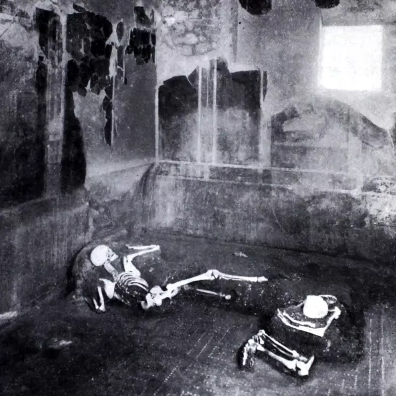 A 1934 photo of the remains of two people found in the House of the Craftsman, in Pompeii.  AP MEAN