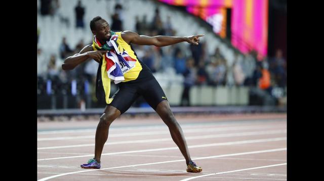 Una foto más con su popular gesto y con las banderas de Jamaica y del Reino Unido en su cuellos. (Foto: AFP)