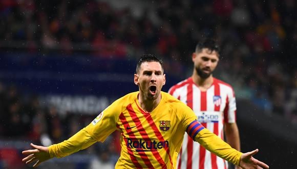 Barcelona's Argentine forward Lionel Messi celebrates after scoring  during the Spanish league football match between Club Atletico de Madrid and FC Barcelona at the Wanda Metropolitano stadium in Madrid, on December 1, 2019. (Photo by GABRIEL BOUYS / AFP)