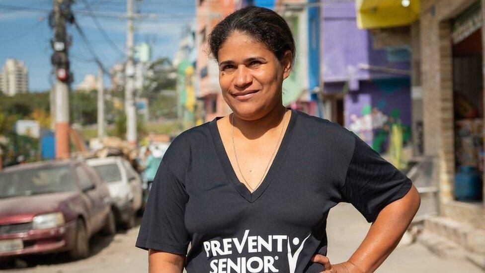 Eliane lives in a favela, but the rent they charge her is more than she can afford.