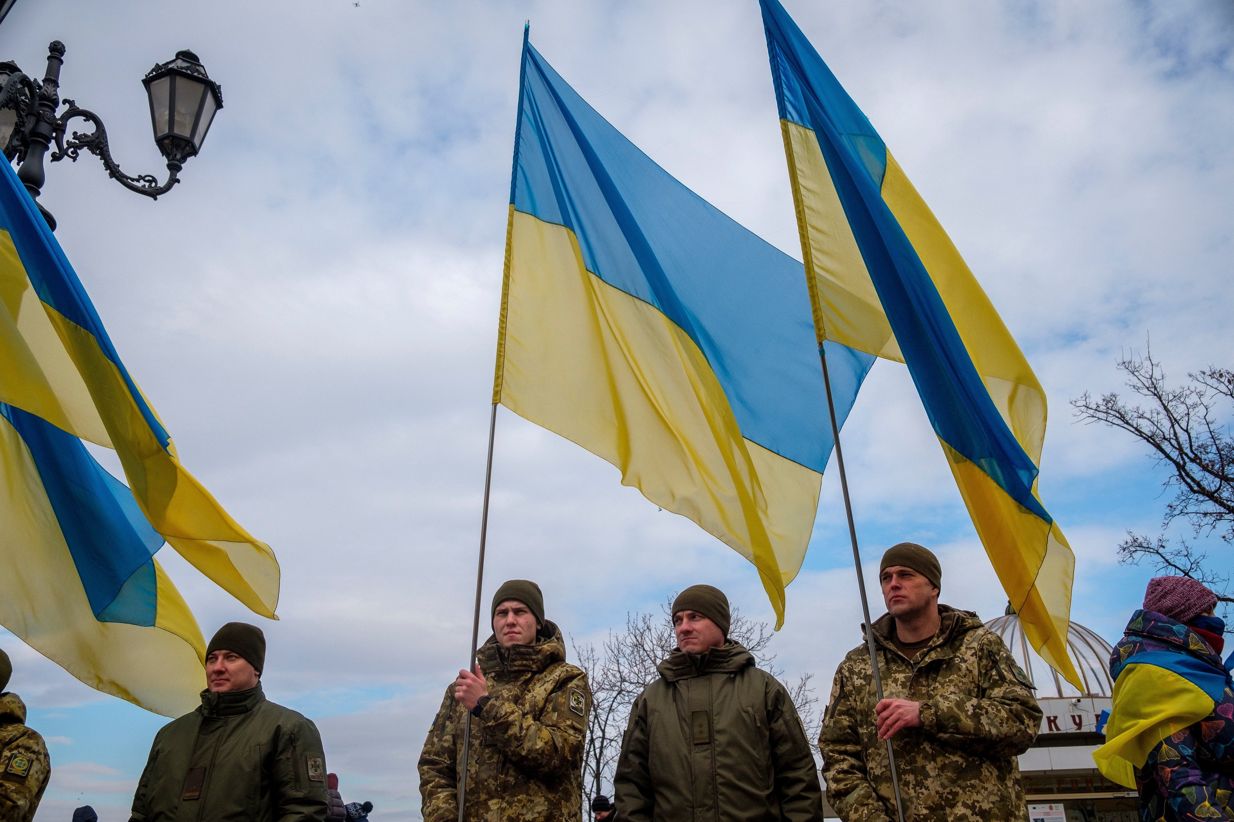 Ukrainian soldiers hold their country's flags during a demonstration in Odessa, Ukraine, on January 22.  (Photo: Bloomberg)
