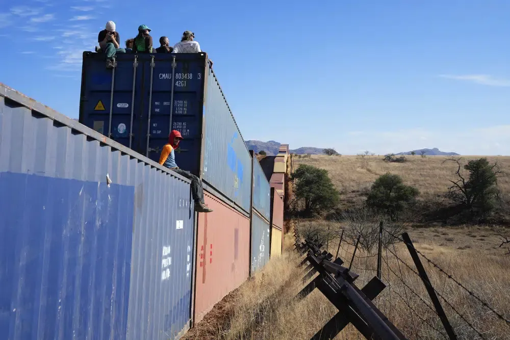 The container wall costs around 95 million dollars and will cover 16 kilometers.  (AP Photo/Ross D. Franklin)