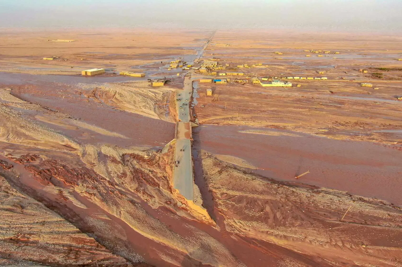 Image from a video provided by Libyan television channel Al-Hadath of flooding and destroyed roads in Al-Mukhaili on Monday.  (Libya Al-Hadath, via Reuters).
