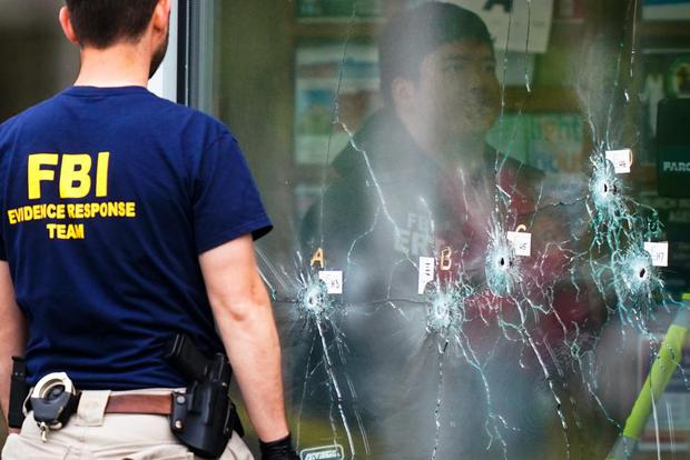 On Monday, May 16, 2022, an FBI investigator was working at the scene of a shooting at a supermarket in Buffalo, NY.  (AP Photo / Matt Rourke)