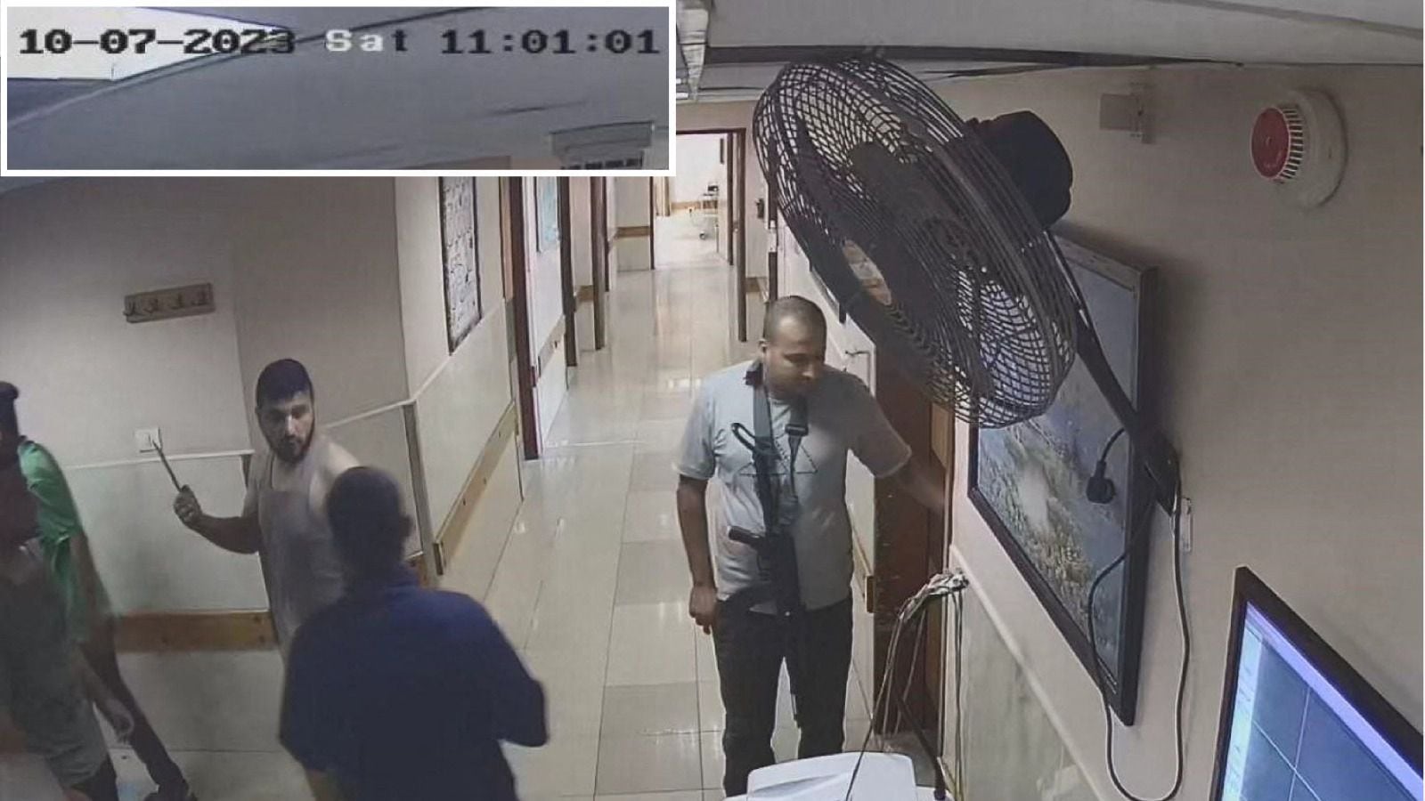 This screenshot taken from a security camera and released by the Israeli military on November 19 shows Hamas fighters at Al Shifa hospital.  (AFP).