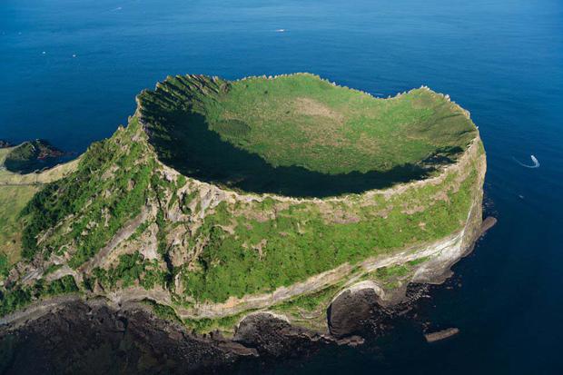 A volcanic view of Jeju Island (South Korea).  The volcanic landscapes and lava tunnels of Jeju Island, in southwestern South Korea, have made it triple UNESCO: World Heritage, Global Geoparks, and Biosphere Reserve.