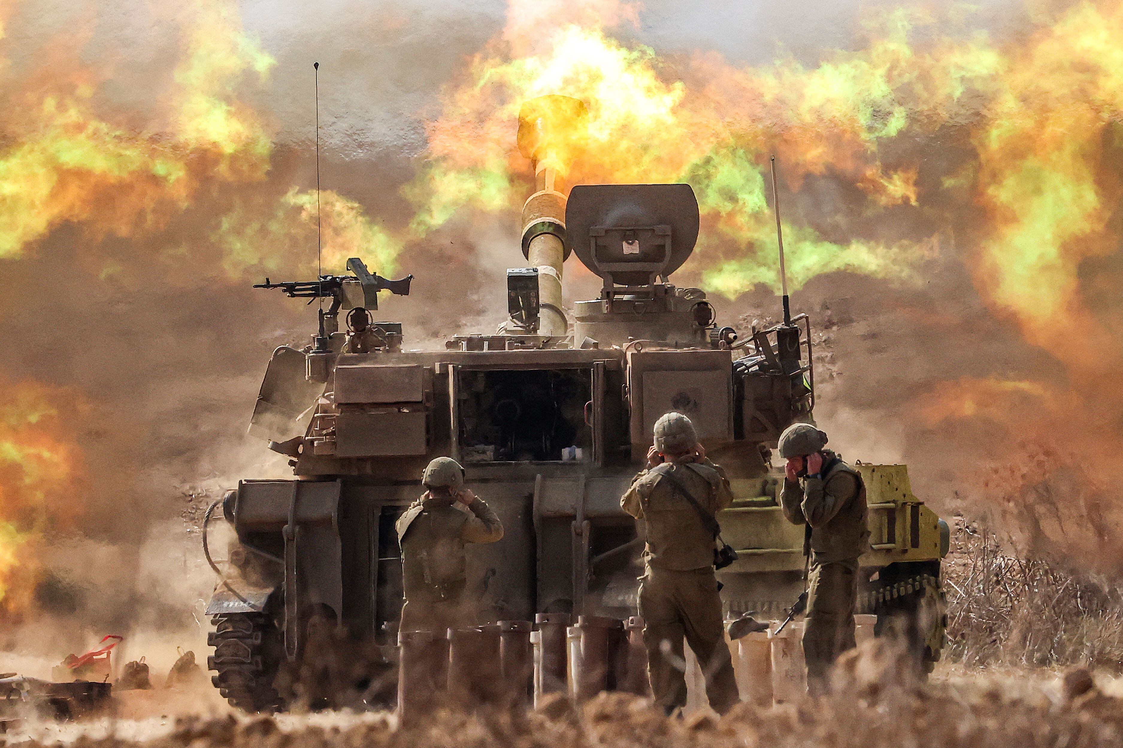 An Israeli Army M109 155mm self-propelled howitzer fires near the border with Gaza, southern Israel, on October 11, 2023. (Photo by JACK GUEZ/AFP).