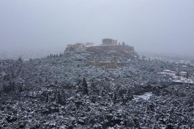 The ancient Acropolis hill is covered in snow in Athens, Greece.  (AP/Michael Varaklas)