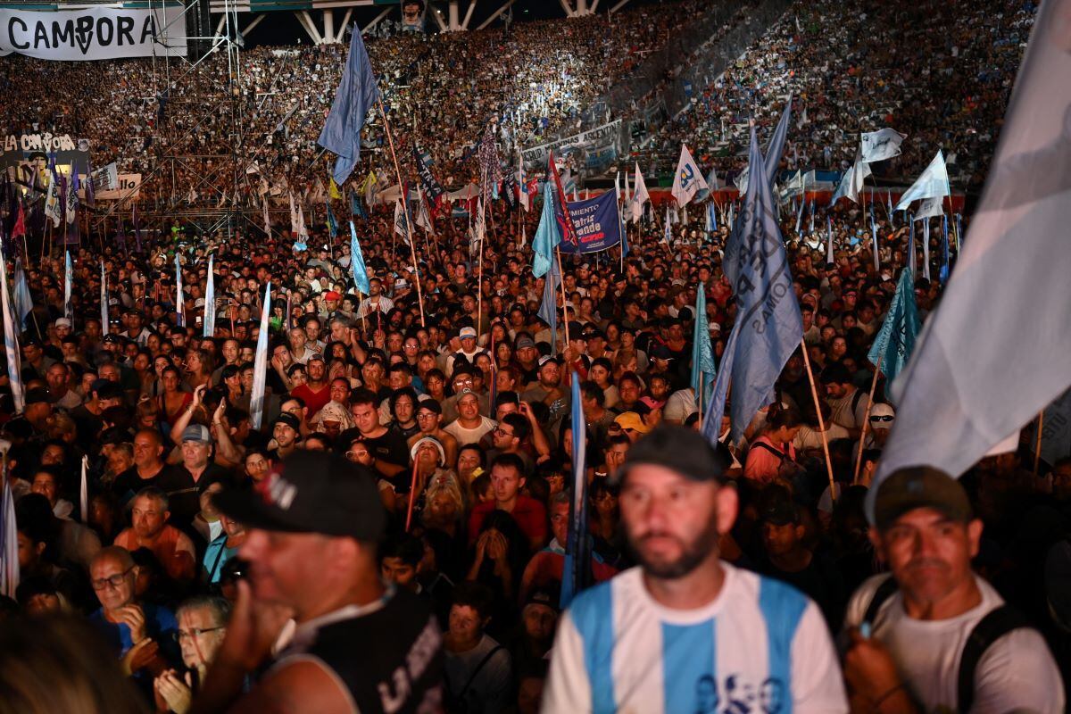 Supporters of Cristina Kirchner listen to her speak during a rally to celebrate Militancy Day at the Único stadium in La Plata.  (LUIS ROBAYO / AFP).