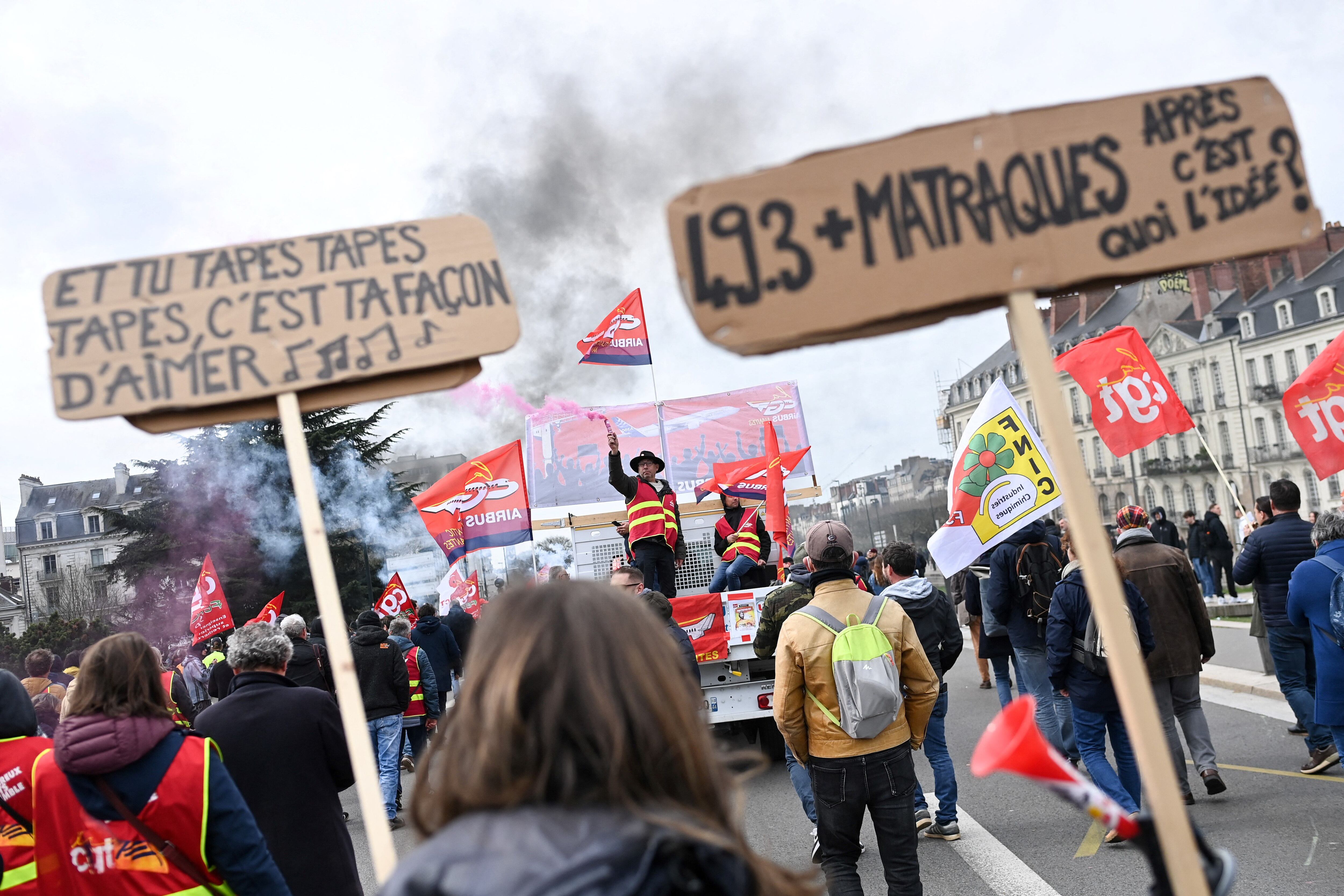People take part in a demonstration after the government pushed a pension reform through parliament without a vote, using article 49.3 of the constitution, in Nantes, western France, on March 28, 2023. (Photo by Sebastien SALOM -GOMIS / AFP)