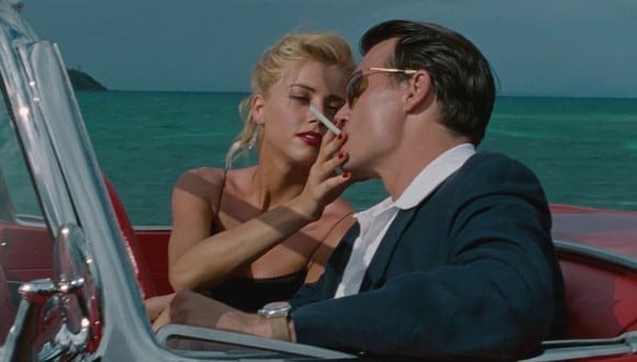 Amber Heard y Johnny Depp dando vida a Chenault y Paul Kemp, respectivamente en "El diario de un seductor" (Foto: Film District)