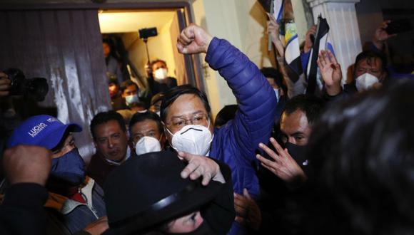 Luis Arce, presidential candidate for the Movement Towards Socialism (MAS) party, raises his fist as he claims victory after general elections in La Paz, Bolivia, Monday, Oct. 19, 2020. (AP Photo/Juan Karita)