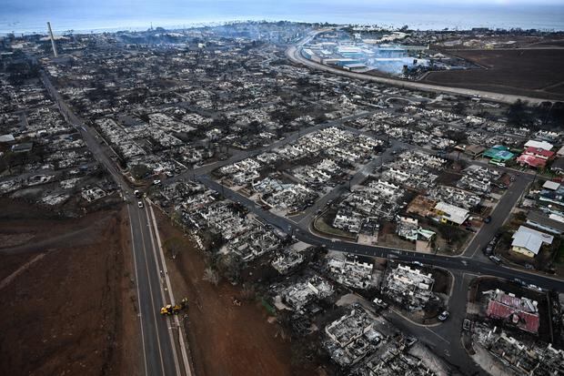 An aerial photo taken on Aug. 10, 2023 shows destroyed homes and burned buildings in Lahaina.  (Photo by Patrick T. Fallon / AFP).