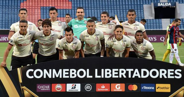 Peru's Universitarios players pose before their Copa Libertadores football match against Paraguay's Cerro Porteno at Pablo Rojas Stadium, in Asuncion, Paraguay, on February 12, 2020.  / AFP / NORBERTO DUARTE