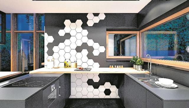 Dale dinamismo a la pared principal con baldosas hexagonales de tonalidades neutras. También elige electrodomésticos de acero inoxidable, ya que aportan brillo y carácter. (Foto: Plasterlina)