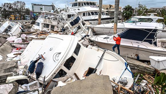 Barcos dañados por el huracán Ian en Fort Myers, Florida, el 29 de septiembre de 2022. (Foto de Giorgio VIERA / AFP)