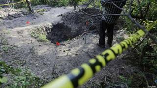 El vértigo de la muerte en las fosas de Iguala, México