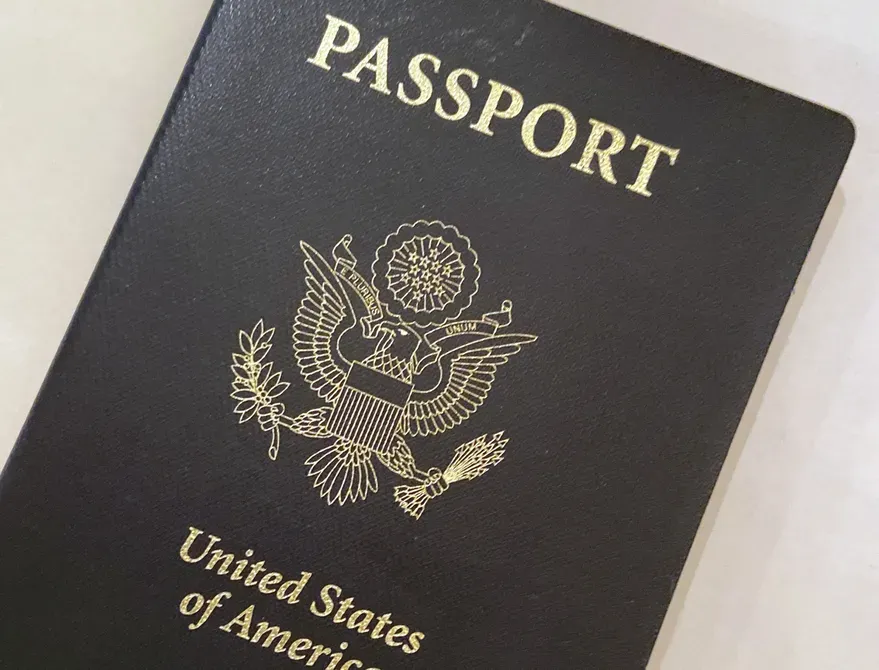 In this May 25, 2021 photo, a United States passport cover is in Washington.  (AP Photo/Eileen Putman)