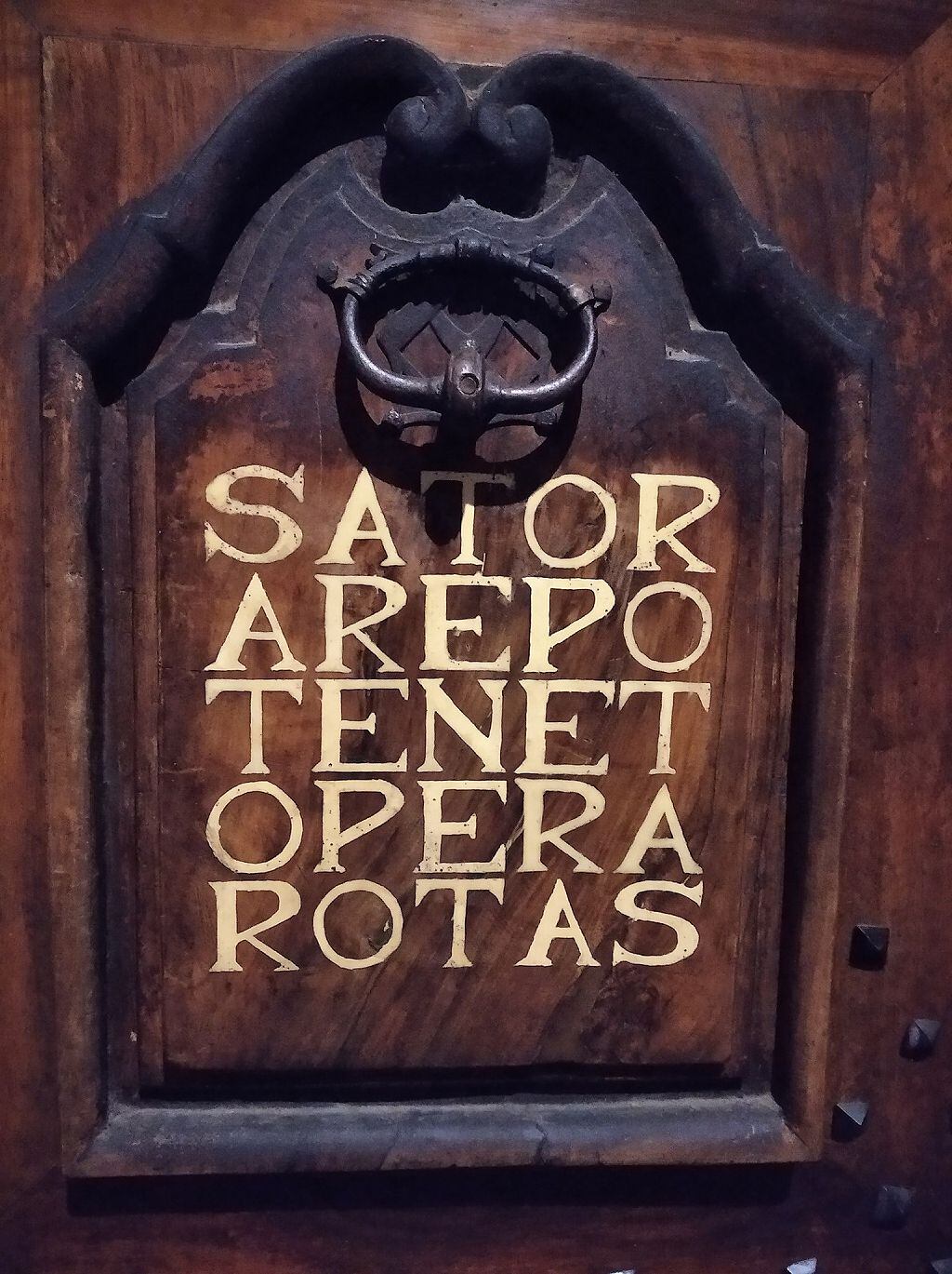 Engraved on a door in Grenoble (France)... Who will be able to decipher them, mathematicians, philologists or theologians?