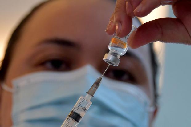 In this file photo taken on January 17, 2021, a healthcare worker prepares a dose of the CoronaVac Sinovac Biotech vaccine against the coronavirus COVID-19 at the Clínicas hospital in Sao Paulo, Brazil.  (NELSON ALMEIDA / AFP).
