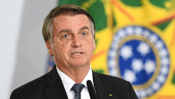 El presidente de Brasil, Jair Bolsonaro, durante el anuncio de la ampliación de los programas sociales para la población de bajos ingresos, en el Palacio Planalto de Brasilia. (Foto: EVARISTO SA / AFP)