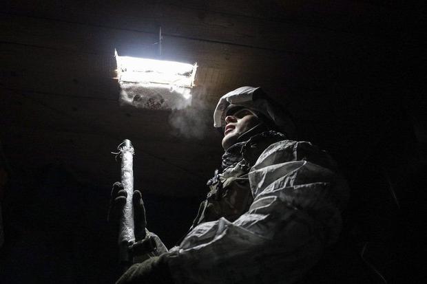 A Ukrainian military man on the front lines near the city of Donetsk last month.  Some 14,000 Ukrainian soldiers have been killed since 2014. (EPA).