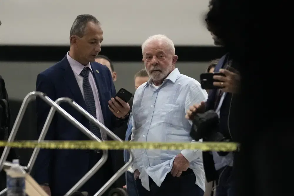 Brazilian President Luiz Inácio Lula da Silva walks in the Planalto Palace after it was stormed by supporters of former President Jair Bolsonaro, in Brasilia.  (AP Photo/Eraldo Peres).