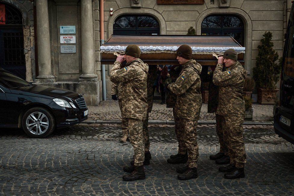 Kotenko's coffin transported to the military church in Lviv.  Three men were buried that day.