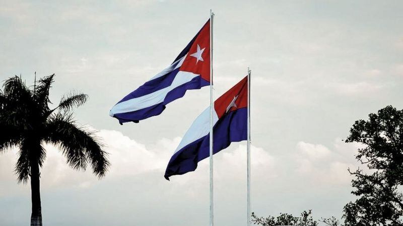 The flag of Carlos Manuel de Céspedes, the same as that of Chile but with inverted colors, presides over many official events.  (GETTY IMAGES)