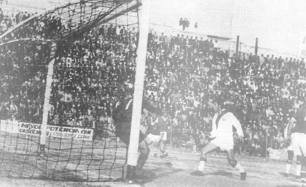 Roberto Chale scores in the Bolivian goal and raises hopes of a victory.  (Photo: GEC Historical Archive)