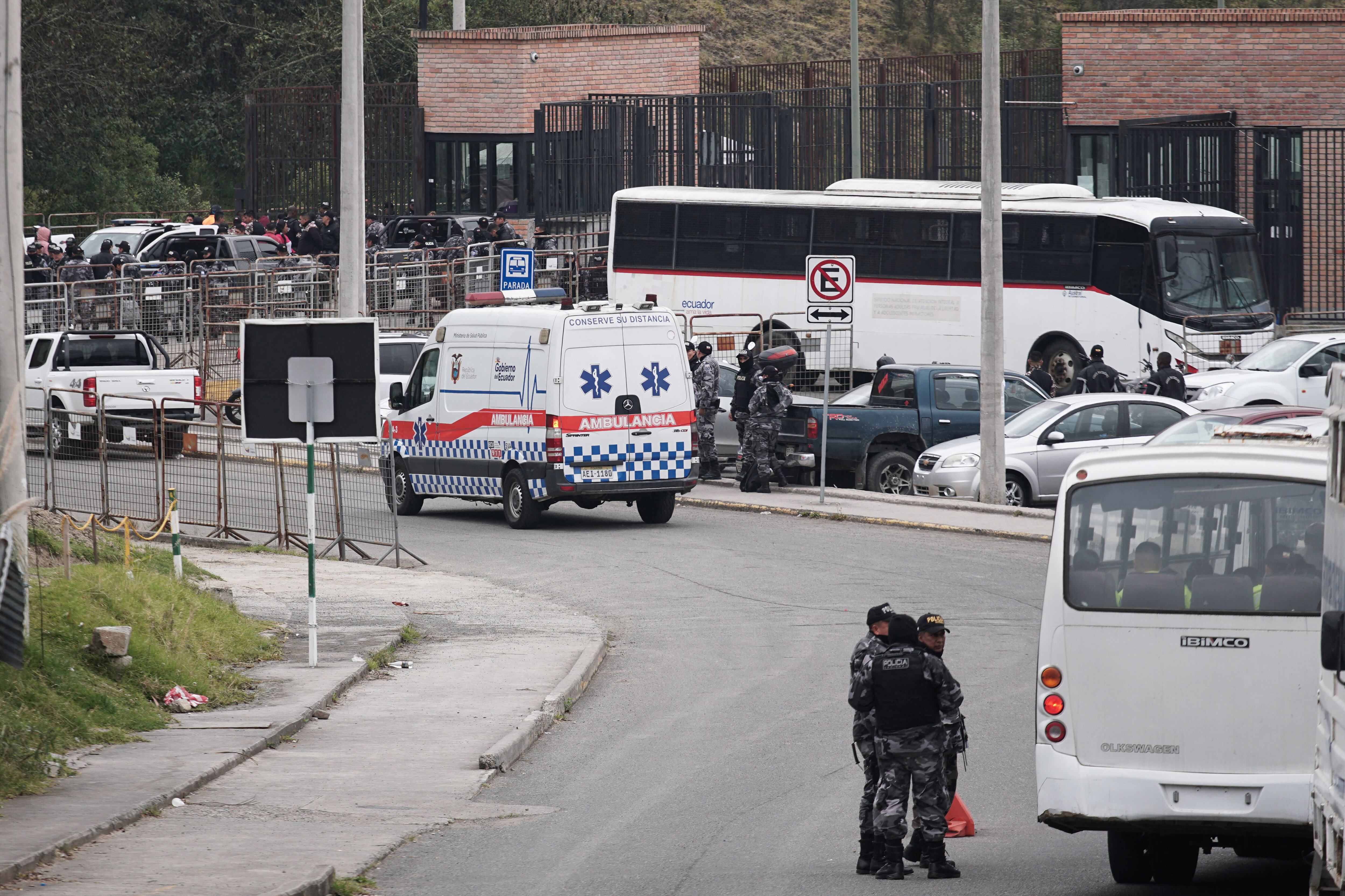 Police officers and an ambulance outside the Turi prison in Cuenca, Ecuador, on September 1, 2023. (Photo by Fernando MACHADO/AFP)