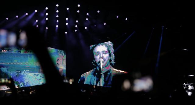 Imagen de Gustavo Cerati proyectada durante "Gracias Totales", el show de Soda Stereo en Lima. (Foto: César Bueno)