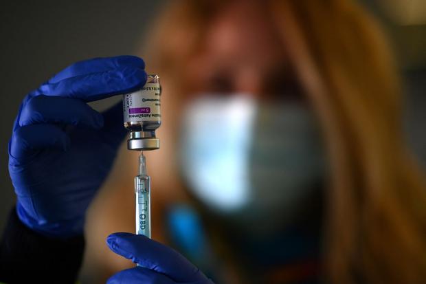 A health worker prepares a dose of the AstraZeneca / Oxford vaccine at a coronavirus vaccination center at the Wanda Metropolitano stadium in Madrid, Spain.  (GABRIEL BOUYS / AFP).