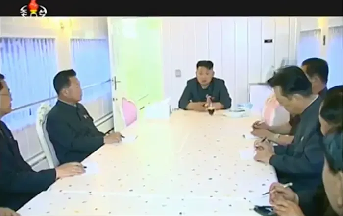 Kim Jong-un in a train meeting room in 2015. (Video capture).