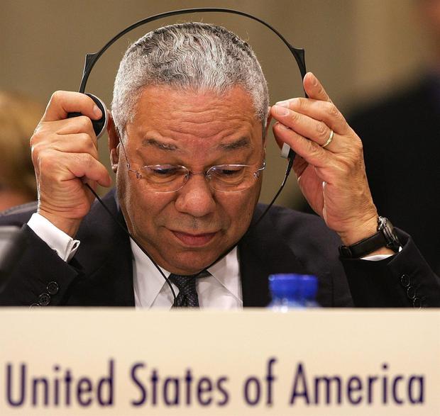 US Secretary of State Colin Powell adjusts his headphones during an OSCE meeting at the Palace of Culture in Sofia, Bulgaria, on December 7, 2004. (EFE / EPA / DIMITAR DILKOFF).