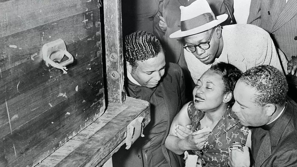Maime, Emmett Till's mother, falls to her knees upon receiving the body of her murdered son.  (GETTY IMAGES).