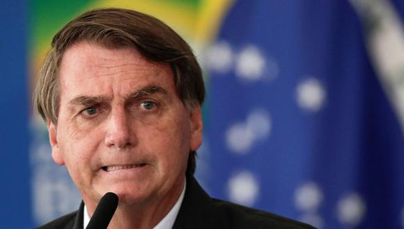 El presidente de Brasil, Jair Bolsonaro, reacciona durante una ceremonia para ampliar la capacidad del gobierno para comprar vacunas contra el COVID-19, en medio del brote de la enfermedad por coronavirus (COVID-19), en Brasilia, el 10 de marzo de 2021. (REUTERS/Ueslei Marcelino).