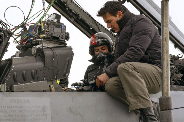 Monica Barbaro gets directions from Tom Cruise on the set of "Top Gun: Maverick"