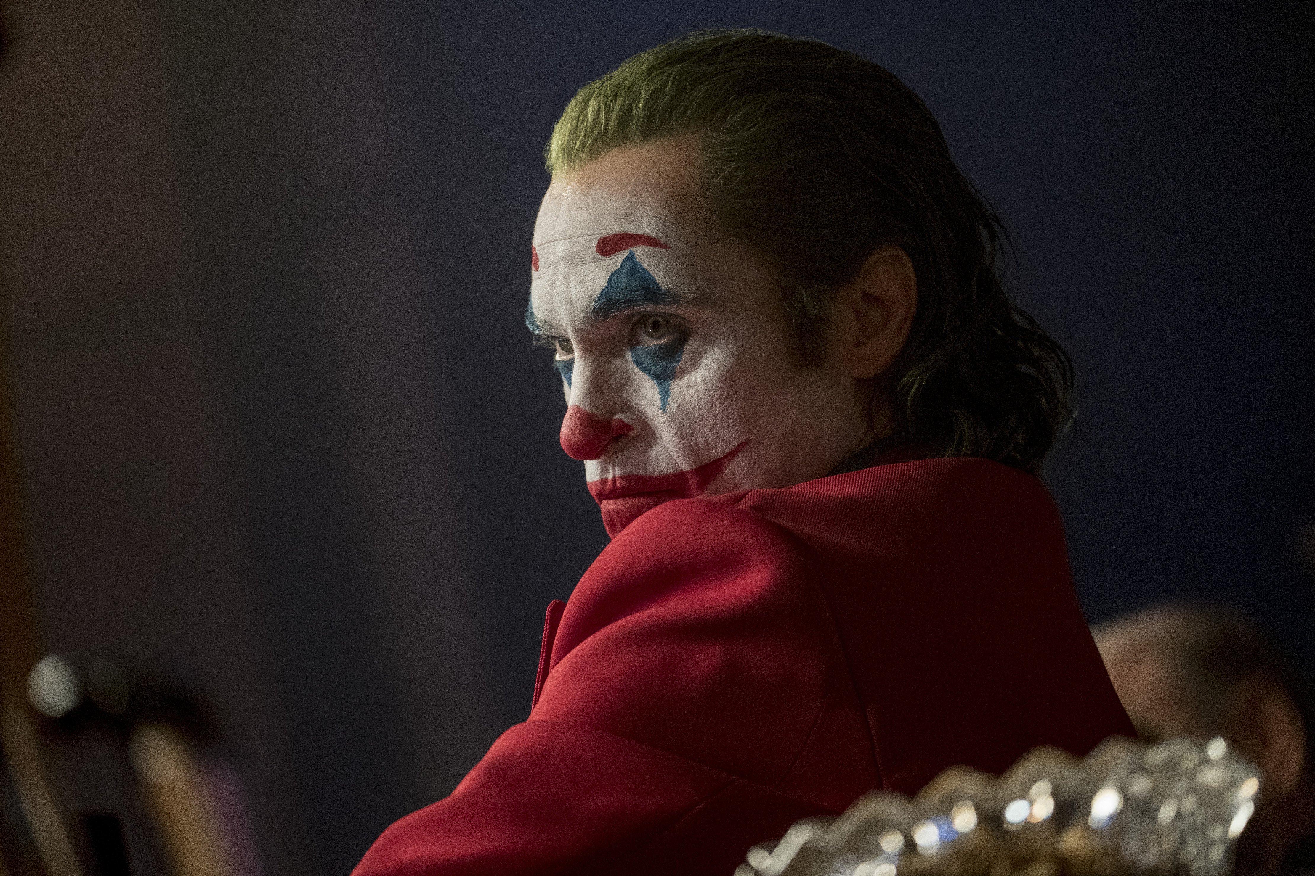 This image released by Warner Bros. Pictures shows Joaquin Phoenix in a scene from "Joker". (Niko Tavernise/Warner Bros. Pictures via AP)