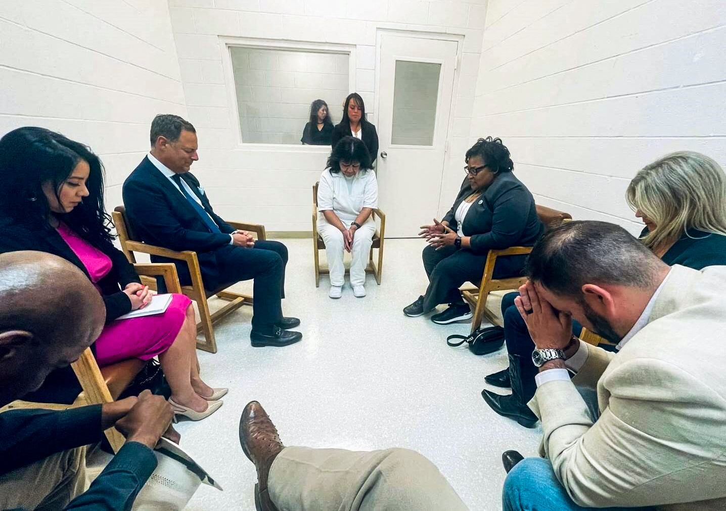 Melissa Lucio bows her head in prayer during a meeting with a bipartisan group of Texas lawmakers at the Gatesville Correctional Facility, Texas, on April 6, 2022. (Jeff Leach/State Rep. Jeff Leach/AFP).