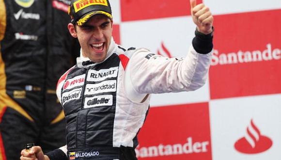 BARCELONA, SPAIN - MAY 13:  Pastor Maldonado of Venezuela and Williams celebrates on the podium after winning the Spanish Formula One Grand Prix at the Circuit de Catalunya on May 13, 2012 in Barcelona, Spain.  (Photo by Mark Thompson/Getty Images)