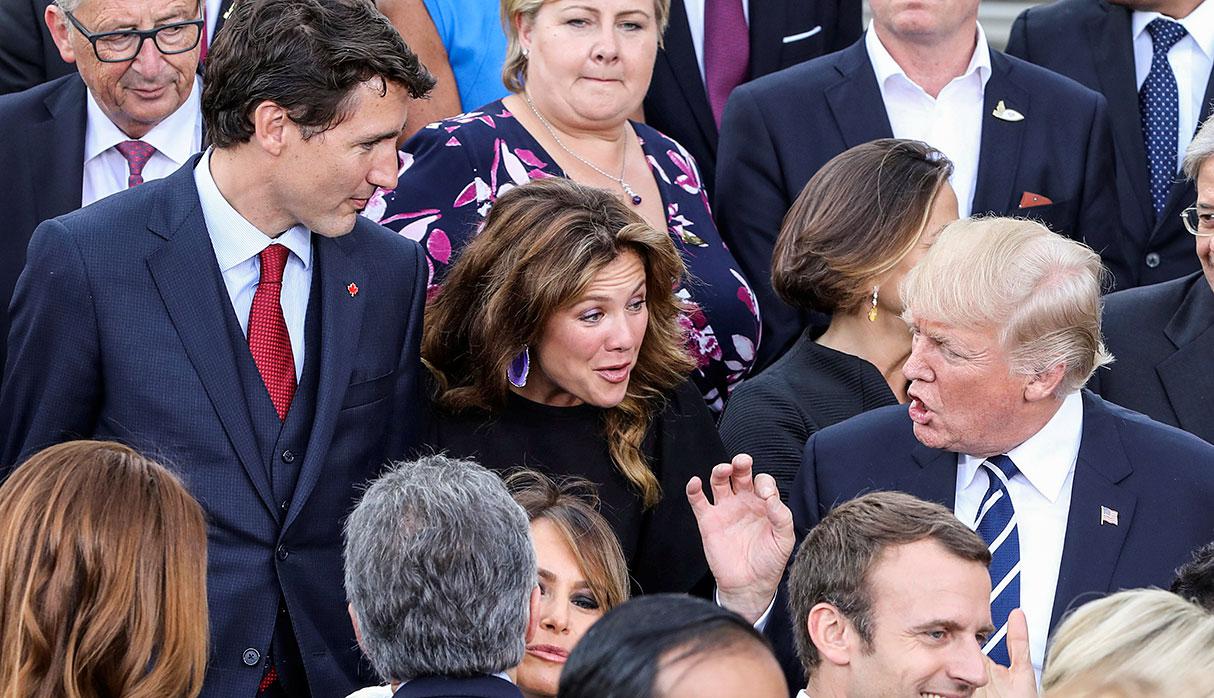 US President Donald Trump (R) talks with Canada's Prime Minister Justin Trudeau (L) and his wife of Canada's Prime Minister Sophie Gregoire (C) as US First Lady Melania Trump (front C) and French President Emmanuel Macron (front R) talk with others after a family photo of the participants of the G20 summit and their spouses prior a concert at the Elbphilharmonie in Hamburg, northern Germany, on July 7, 2017.      REUTERS/LUDOVIC MARIN/Pool