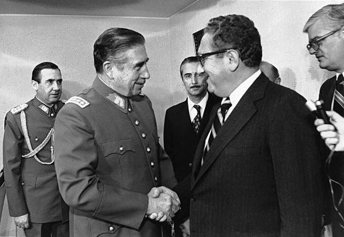 Pinochet receives Kissinger in his office, in a photo from June 8, 1976, in Santiago, Chile.