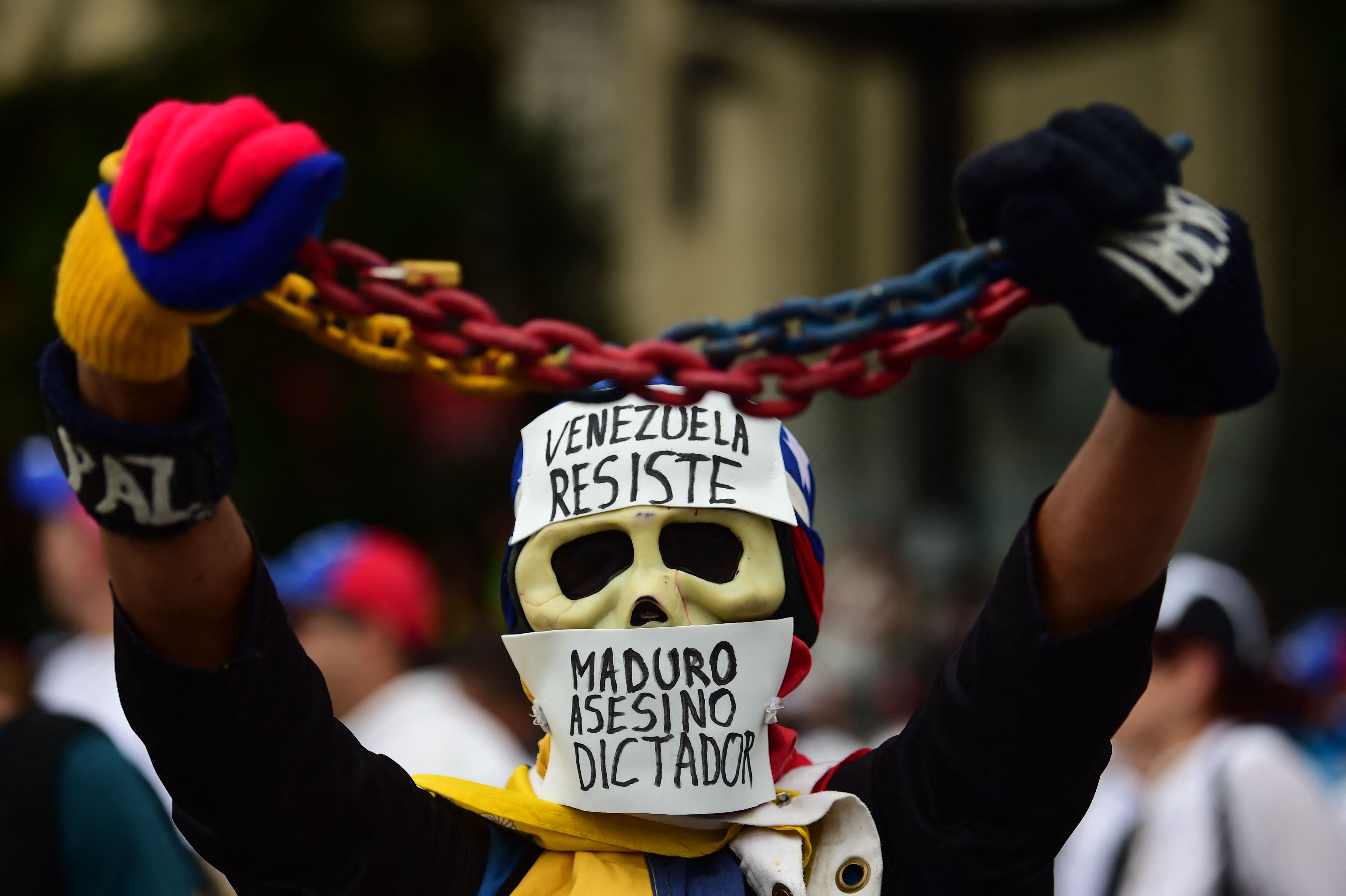 An opposition activist takes part in a march against President Nicolás Maduro in Caracas, on May 1, 2017. (Photo by RONALDO SCHEMIDT/AFP).