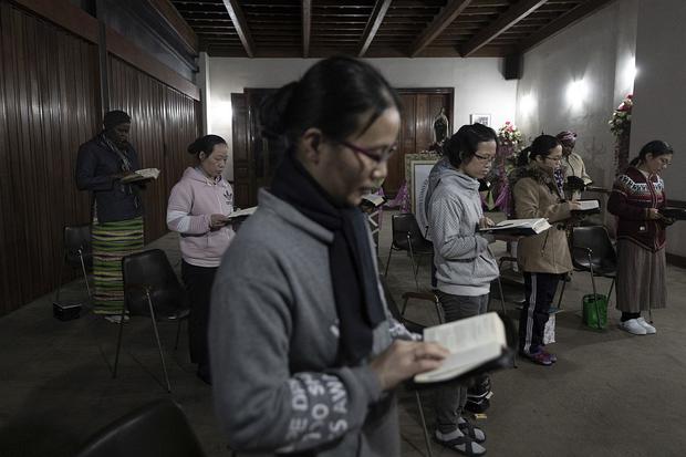 Praying in the chapel of the house located on the second floor.  It is not open to the public.