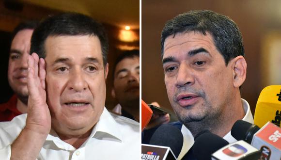 El expresidente de Paraguay, Horacio Cartes (I), y el actual vicepresidente, Hugo Velázquez (D). (Foto de Norberto DUARTE / AFP)